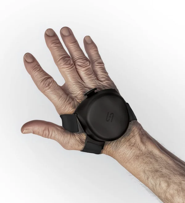 The Steadi-3 Plus glove on the back of a hand, with its round magnetic unit